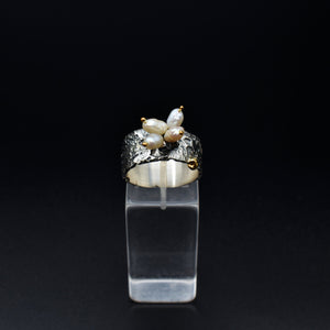 Boho-chic gold & silver ring adorned with natural pearls