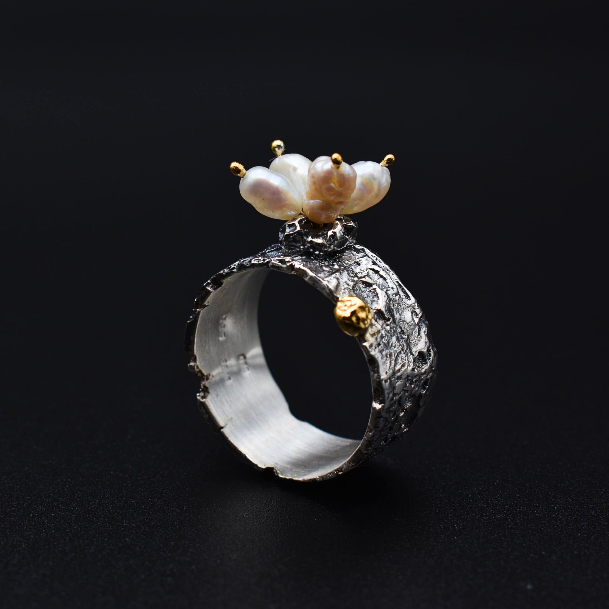 Boho-chic gold & silver ring adorned with natural pearls