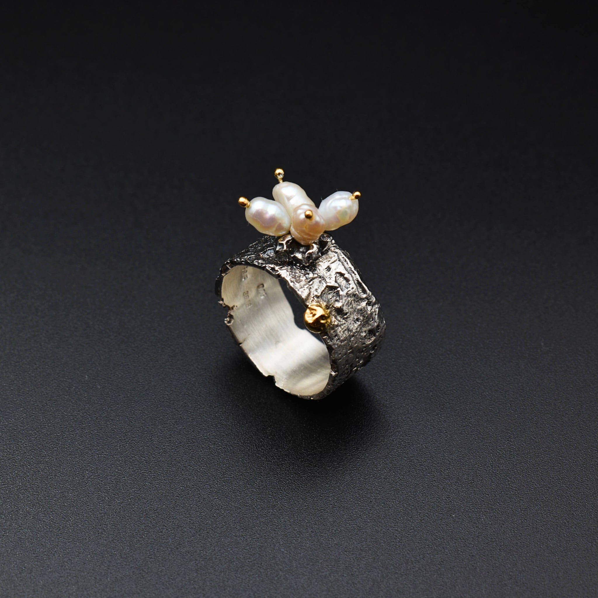 Boho-chic gold & silver ring adorned with natural pearls