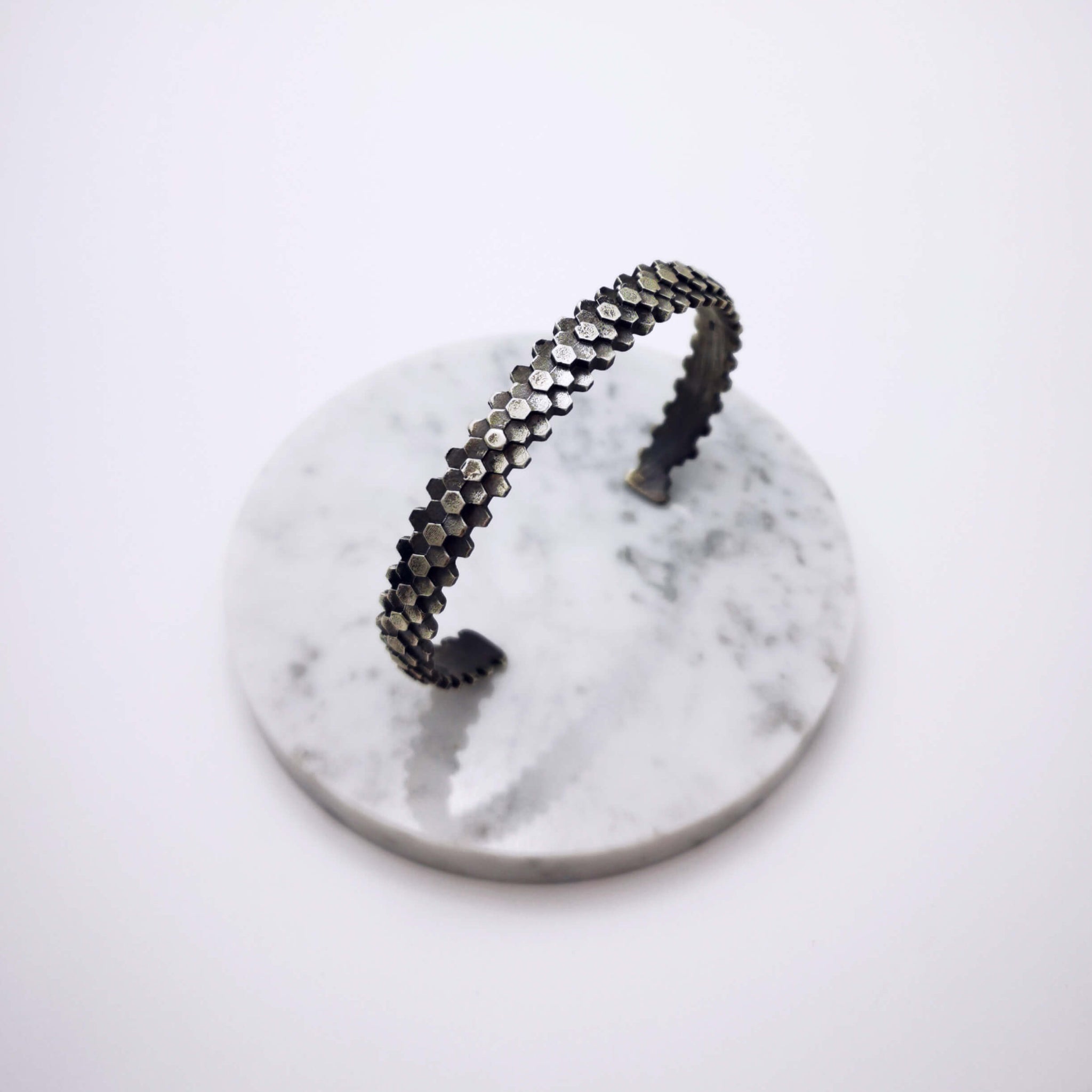 Elegant handcrafted silver braceletet inspired by a specific angular rock formation in Ireland. The bracelet is oxidized.