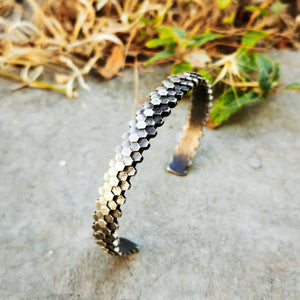 Elegant handcrafted silver braceletet inspired by a specific angular rock formation in Ireland. The bracelet is oxidized.