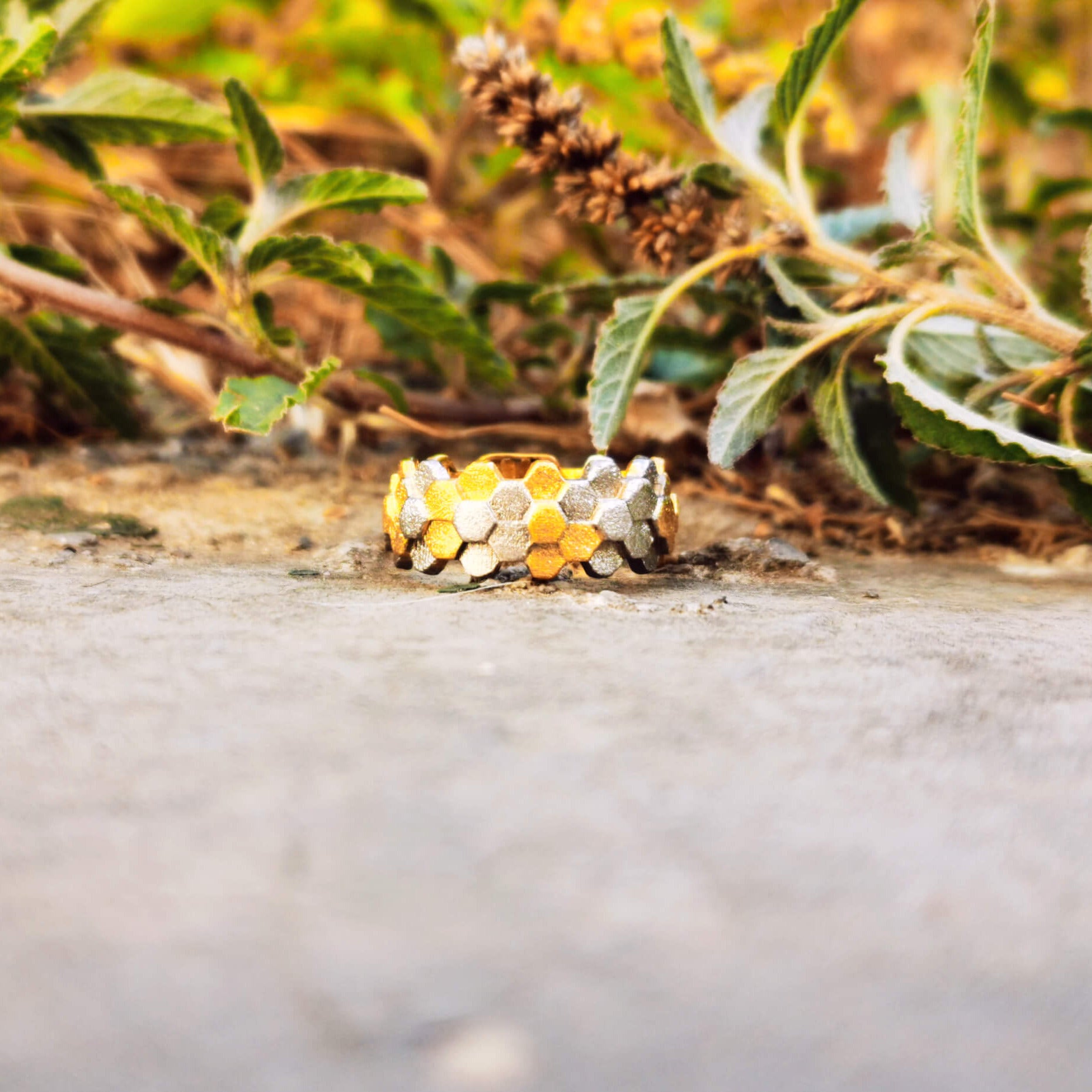 Elegant handcrafted silver ring inspired by a specific angular rock formation in Ireland. The ring have some parts gold plated.