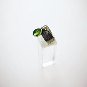 Silver ring with green tourmaline and gold granules