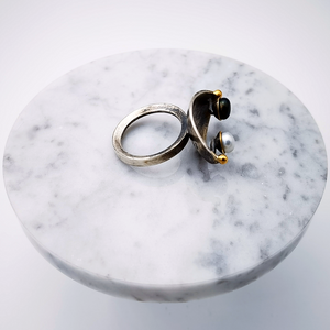 Handcrafted silver ring with 2 gold granules and a pair of black and white pearls.Silver ring oxidized with gold.