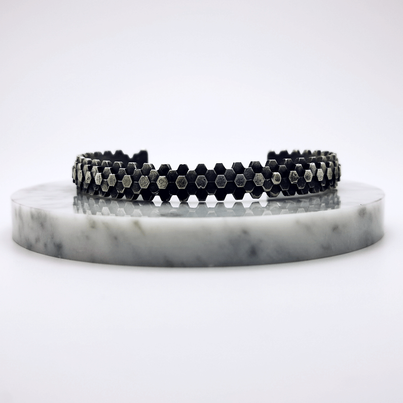 Elegant handcrafted silver braceletet inspired by a specific angular rock formation in Ireland. The bracelet is oxidized.