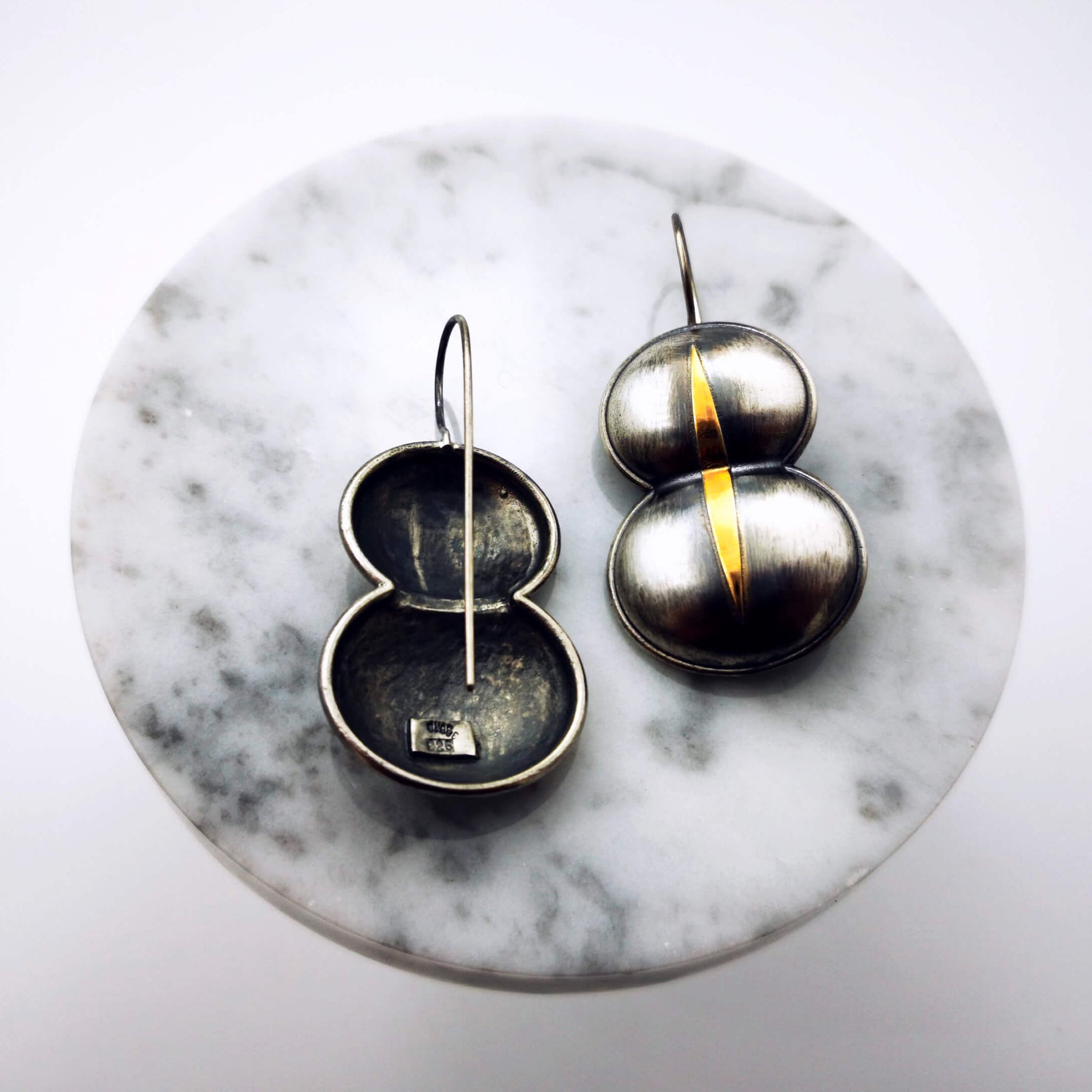 Stylish and elegant silver earrings that inspired by an ancient mural in Knossos Palace in Crete. The earrings are oxidized and a part of it gold plated.