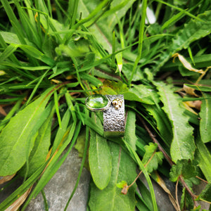 Silver ring with green tourmaline and gold granules